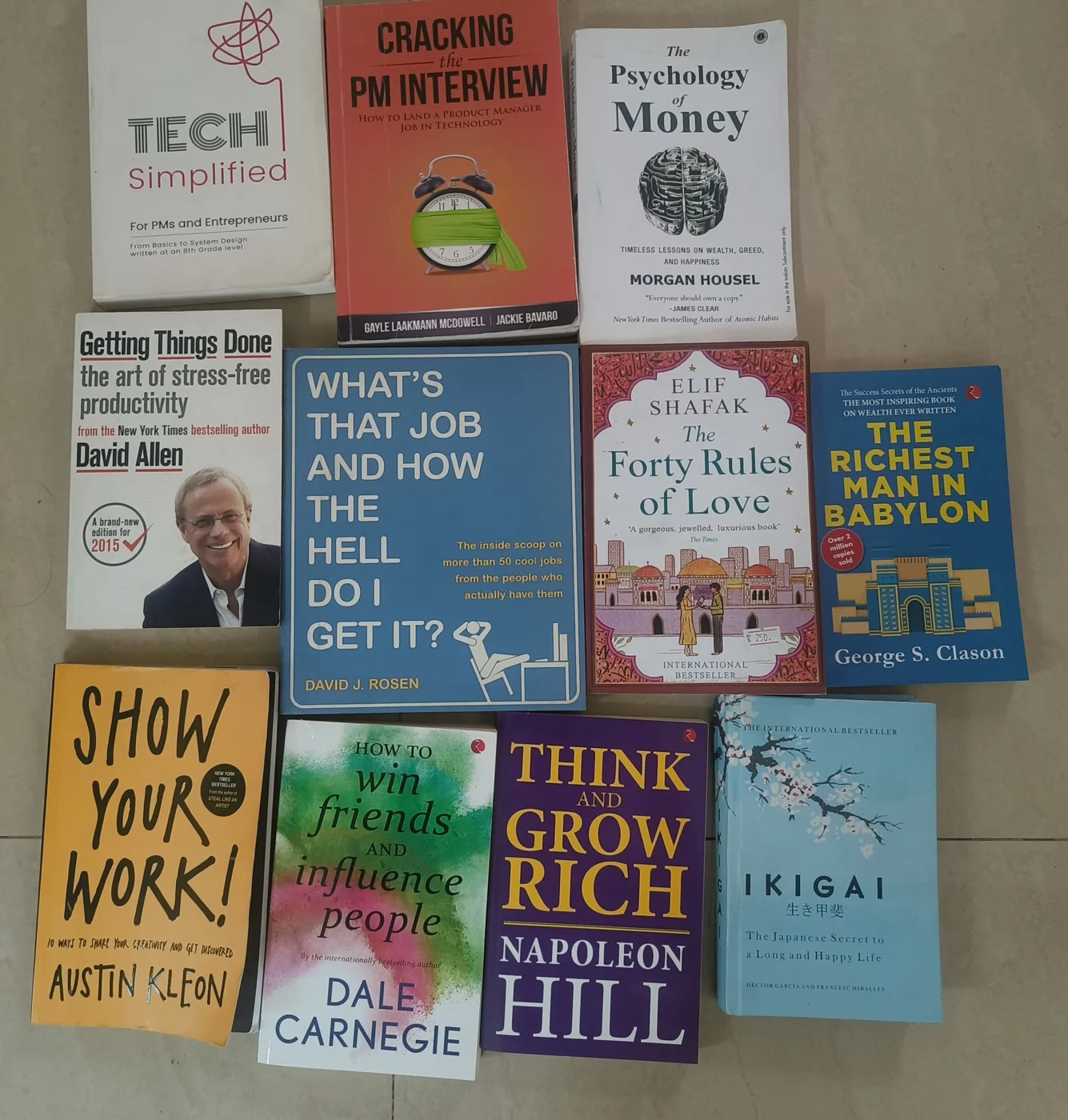 The stack of self-help books Sneha offered to pass on after moving to Kindle.